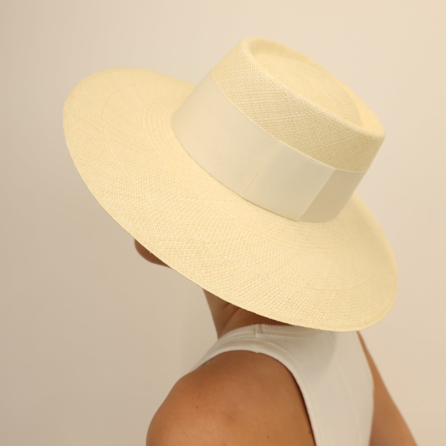 Cream-colored straw boater hat from Ibiza, a genuine Panama hat with wide brim design