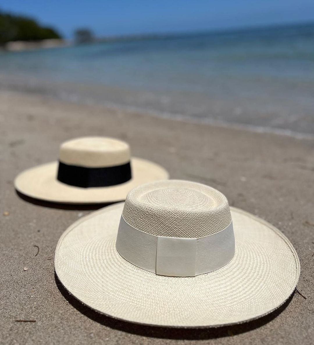 Two Ibiza Wide Brim Toquilla Straw hats showcasing genuine Panama hat style