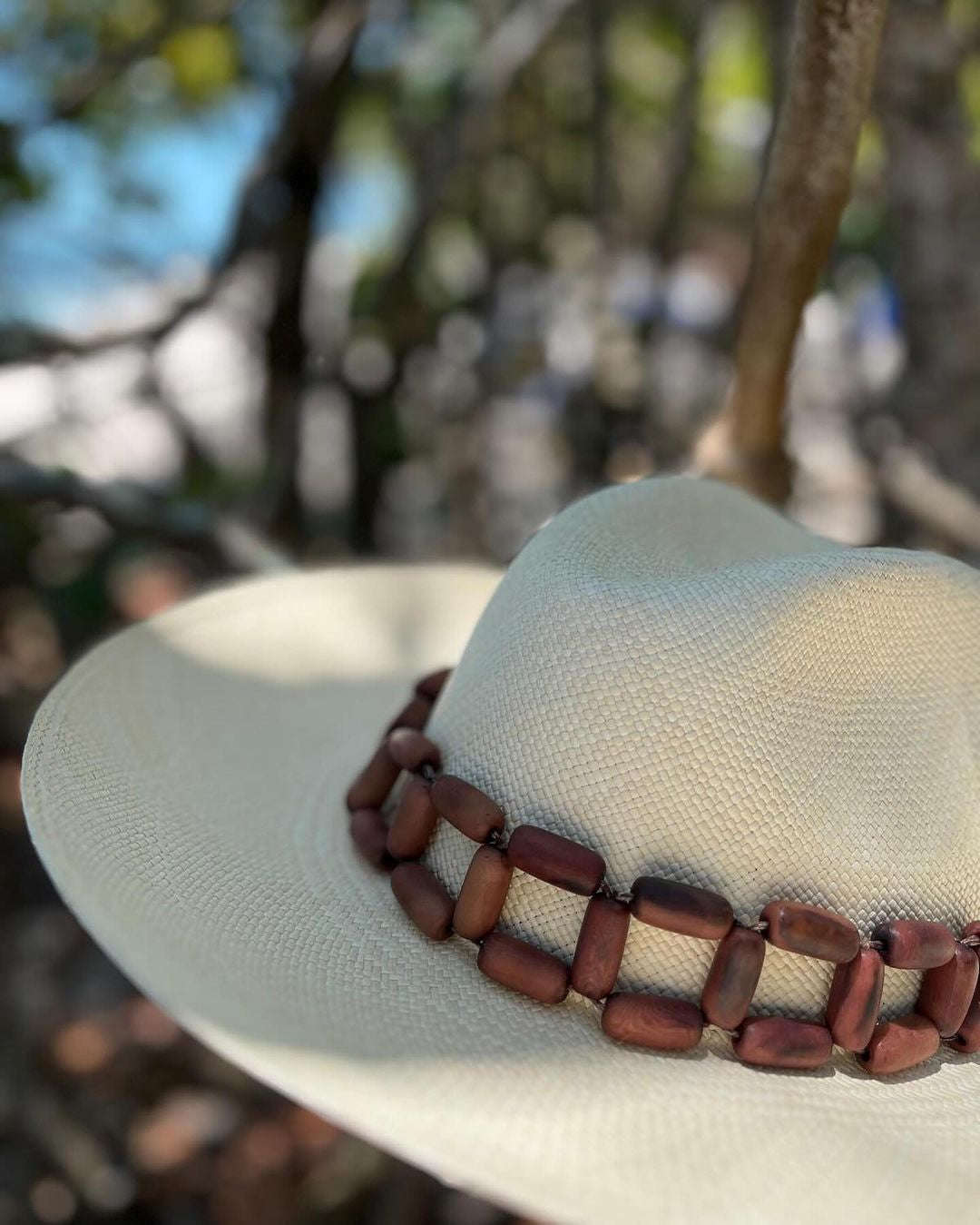Handcrafted Ine Panama hat made of toquilla straw with a stylish wooden bead band