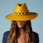 Handcrafted yellow toquilla straw Panama hat with a stylish wooden chain