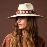Handcrafted Ine Panama hat features a wide-brimmed design and toquilla straw with bead band