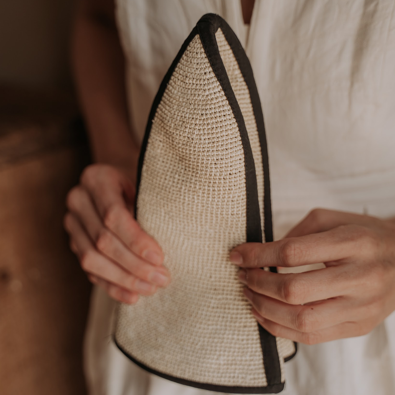 Woven sauna hat with dark trim made from natural toquilla straw, named Sandra - Foldable