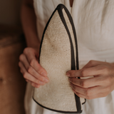 Woven sauna hat with dark trim made from natural toquilla straw, named Sandra - Foldable