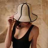 Beige toquilla straw hat with black trim, named Sandra - Foldable, stylish and versatile