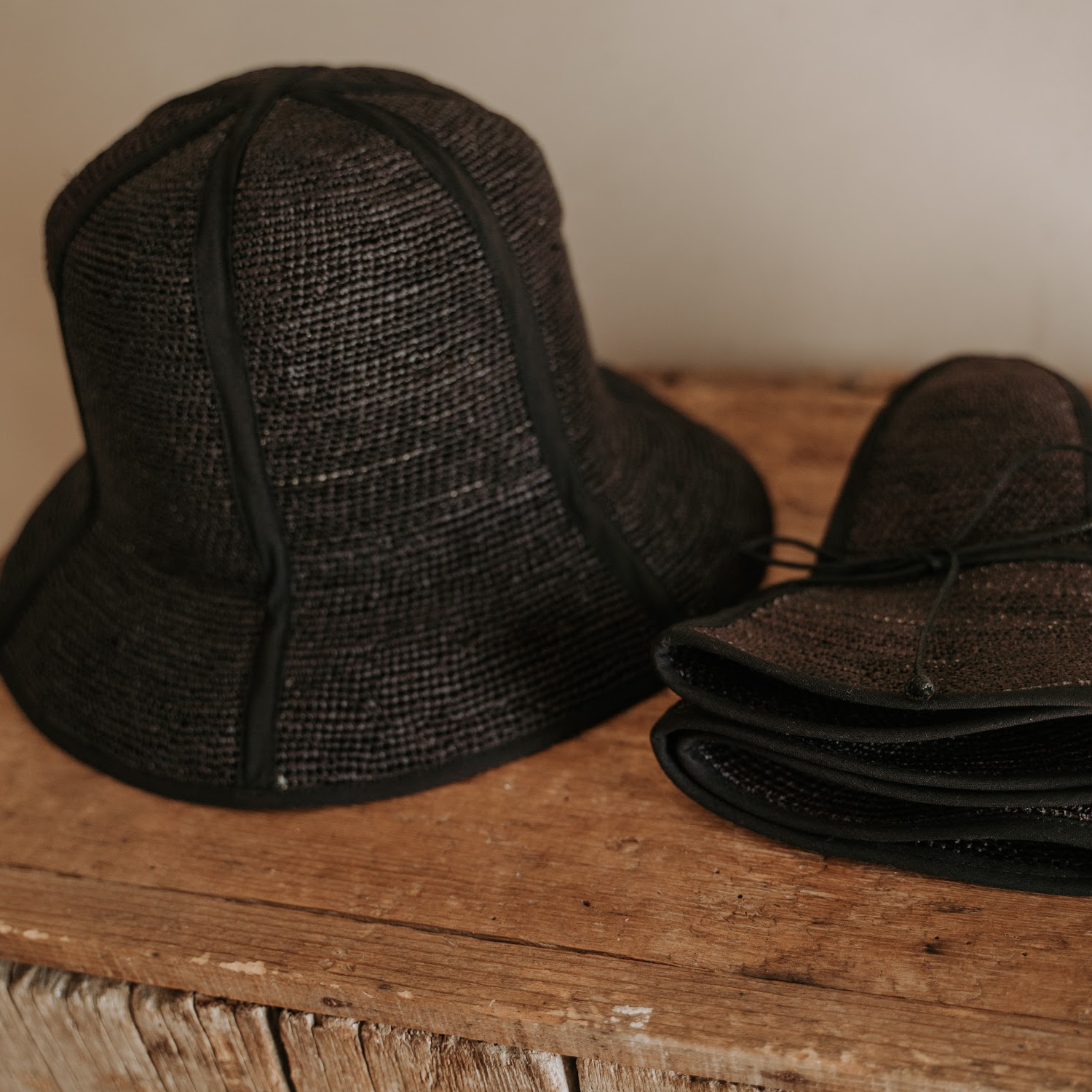 Black woven sun hats made from natural toquilla straw, perfect for stylish sun protection