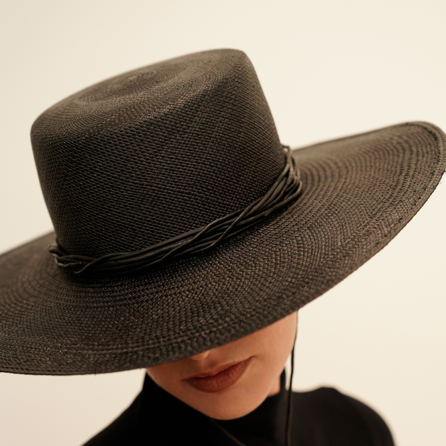Black wide brim Jacaranda toquilla straw hat with twisted band for stylish sun protection