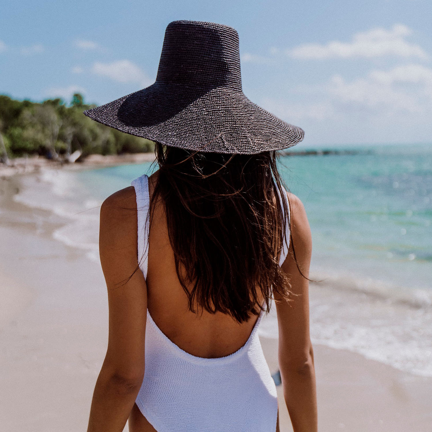 Woman in white swimsuit with wide-brimmed hat from Verona Extra Wide Brim Packable