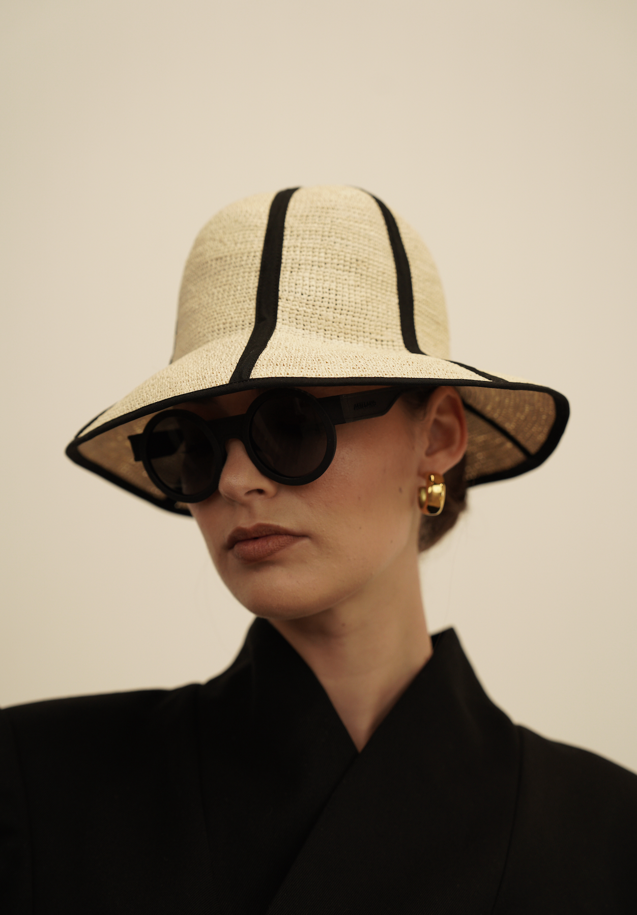 Stylish Sandra Foldable Hat in Natural Toquilla Straw with Black Trim