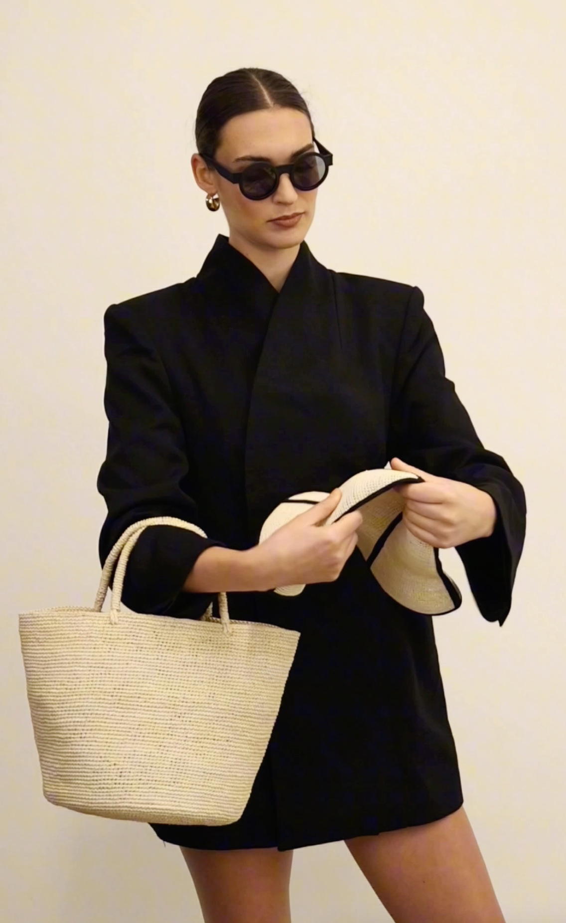 Woven straw tote bag made of natural toquilla straw, featuring the Sandra - Foldable design