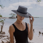 Black straw hat Raku - Wide Brim adorned with tagua nut beads for stylish summer flair