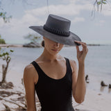 Black straw hat Raku - Wide Brim adorned with tagua nut beads for stylish summer flair