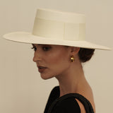 Wide-brimmed white Toquilla straw hat named Pinta, a genuine Panama hat, ethically handcrafted
