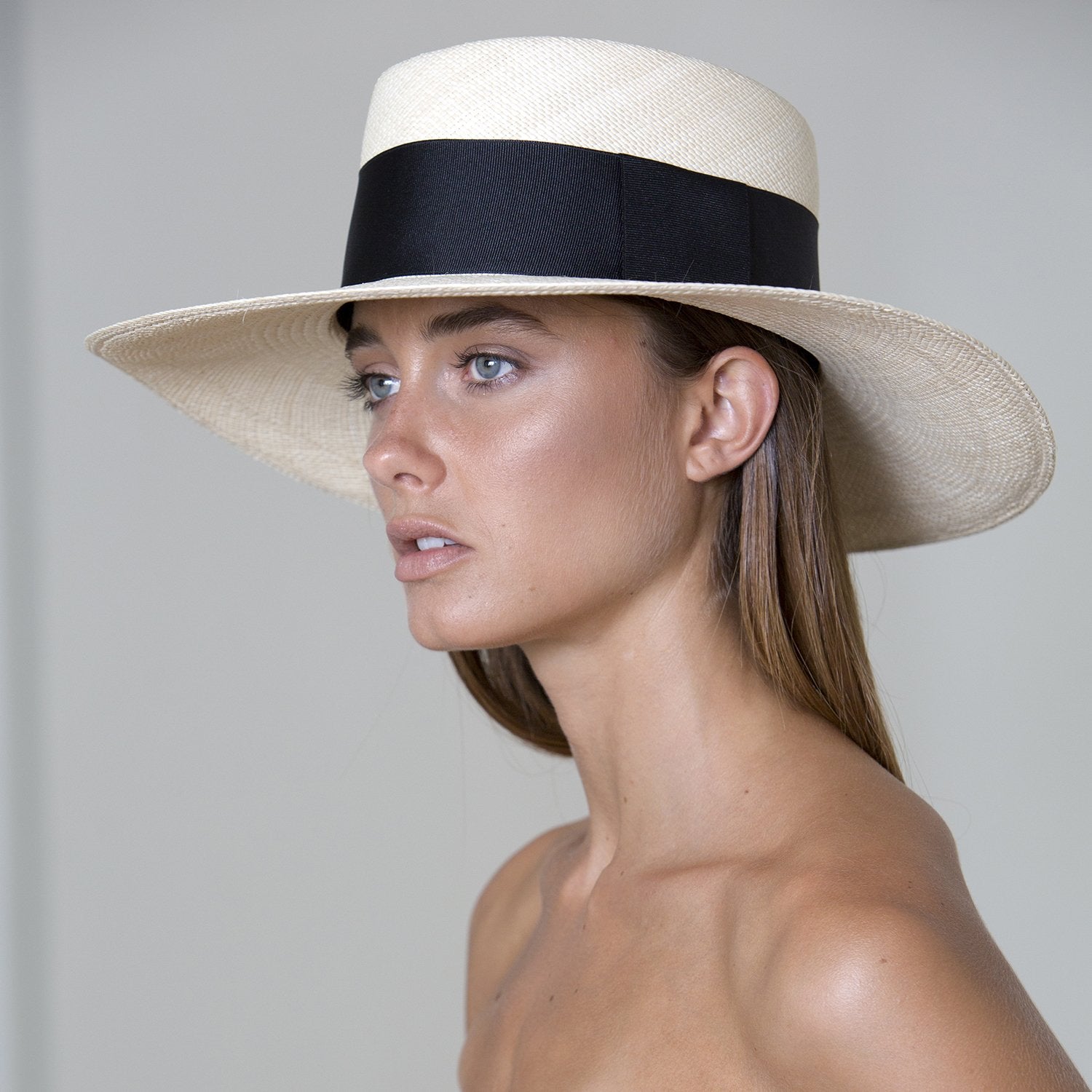 Wide-brimmed straw hat with a black band, a genuine Panama hat made of toquilla straw