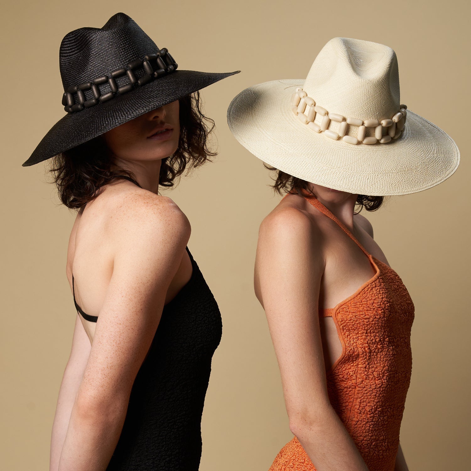 Two ethically handcrafted toquilla straw hats with decorative bands from Ine