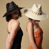 Two ethically handcrafted toquilla straw hats with decorative bands from Ine
