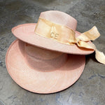 Two hand dyed pink Toquilla straw hats with custom initials for personalized style