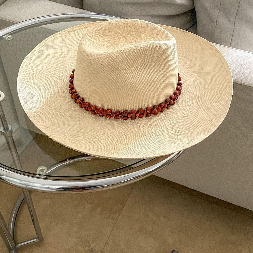 Beaded straw hat from Peoni featuring a wide brim and genuine Panama hat craftsmanship
