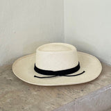 Wide brim Puglia genuine Panama hat made of toquilla straw with a black band