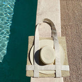 Woven Nativa tote bag with natural toquilla straw, hat, and decorative plates