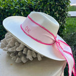White toquilla straw hat with pink ribbon, custom initials, and hand dyed design