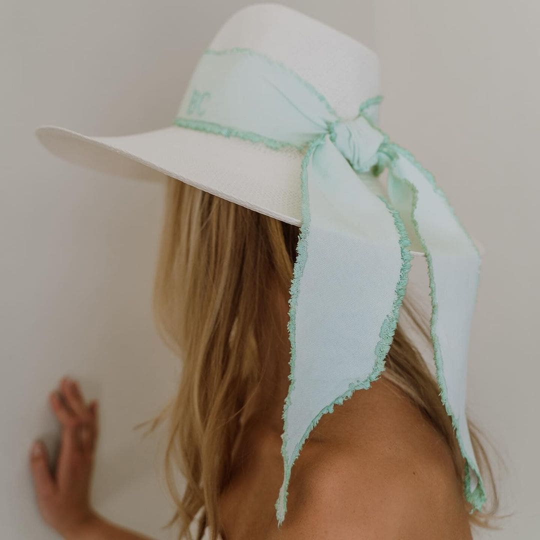 White sun hat with light blue ribbon, a genuine Panama hat made of hand dyed toquilla straw