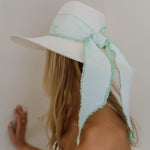 White sun hat with light blue ribbon, a genuine Panama hat made of hand dyed toquilla straw
