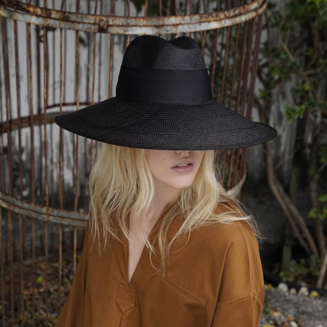 Wide-brimmed black straw hat made from sustainable Toquilla straw, Antibes design
