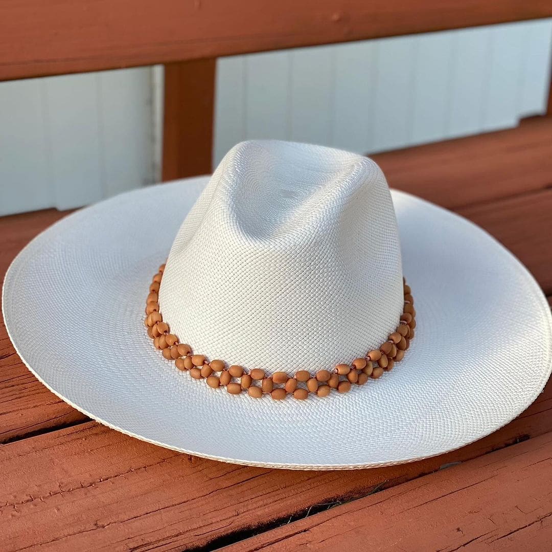 White wide brim toquilla straw hat with beaded band, a genuine Panama hat from Peoni