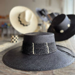 Black straw boater hat named Toledo made from natural toquilla straw for stylish elegance
