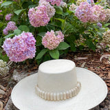 Wide-brimmed straw hat adorned with tagua nut beads in the Raku - Wide Brim product