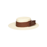 Cream-colored toquilla straw boater hat with brown woven band and fringe, sustainable design