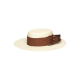 Cream-colored toquilla straw boater hat with brown woven band and fringe, sustainable design