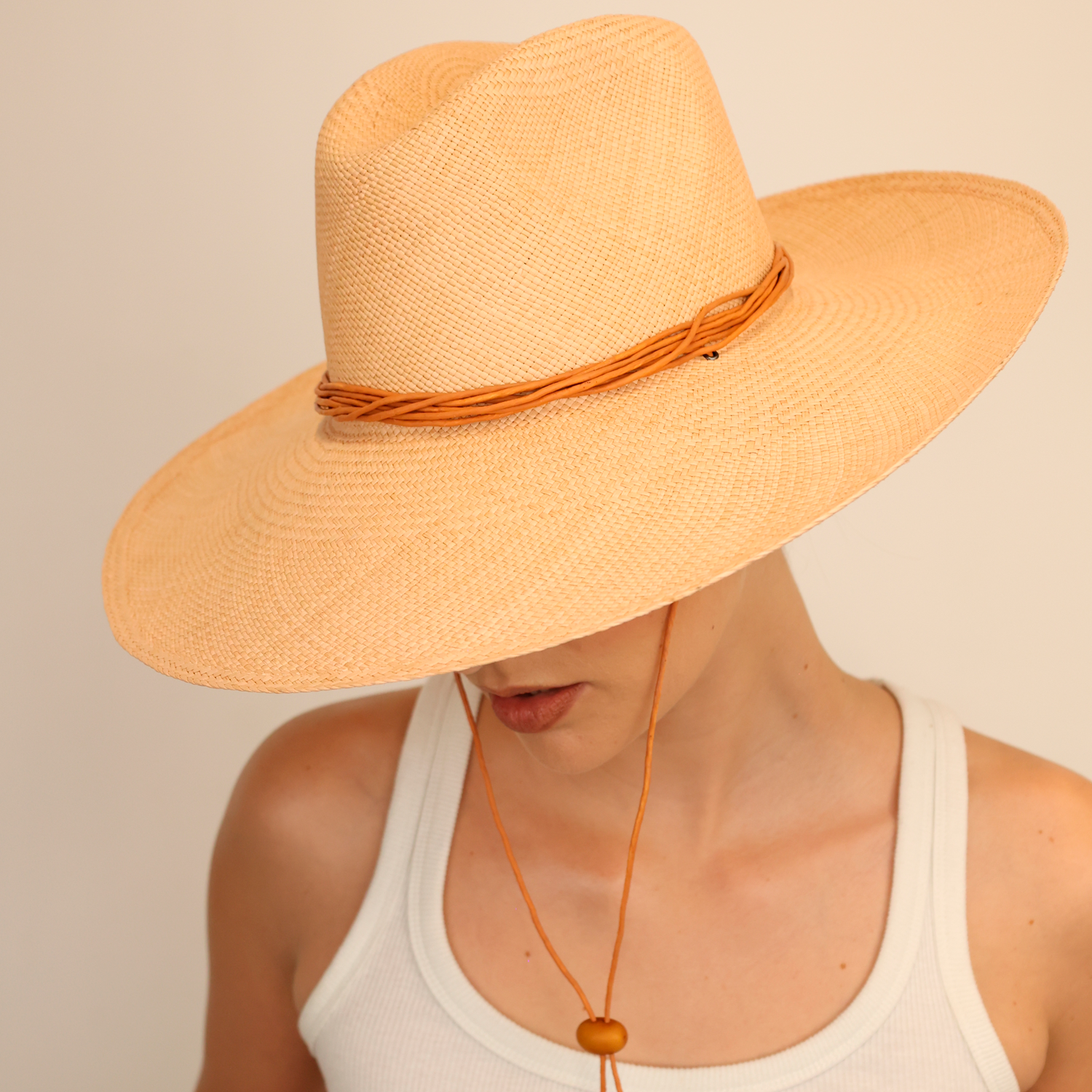 Wide-brimmed straw hat named Bromelia with chin strap made from natural toquilla straw