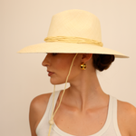 Wide-brimmed straw hat made from natural Toquilla straw with a chin strap, Bromelia