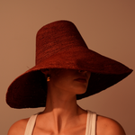 Wide-brimmed brown straw hat from Verona, featuring an extra wide brim and packable design