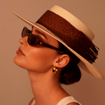 Woman in a Caracara genuine Panama hat made from toquilla straw, with sunglasses