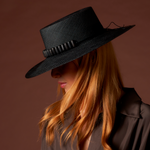 Black straw hat with tagua nut beads in a stylish beaded band for sun protection