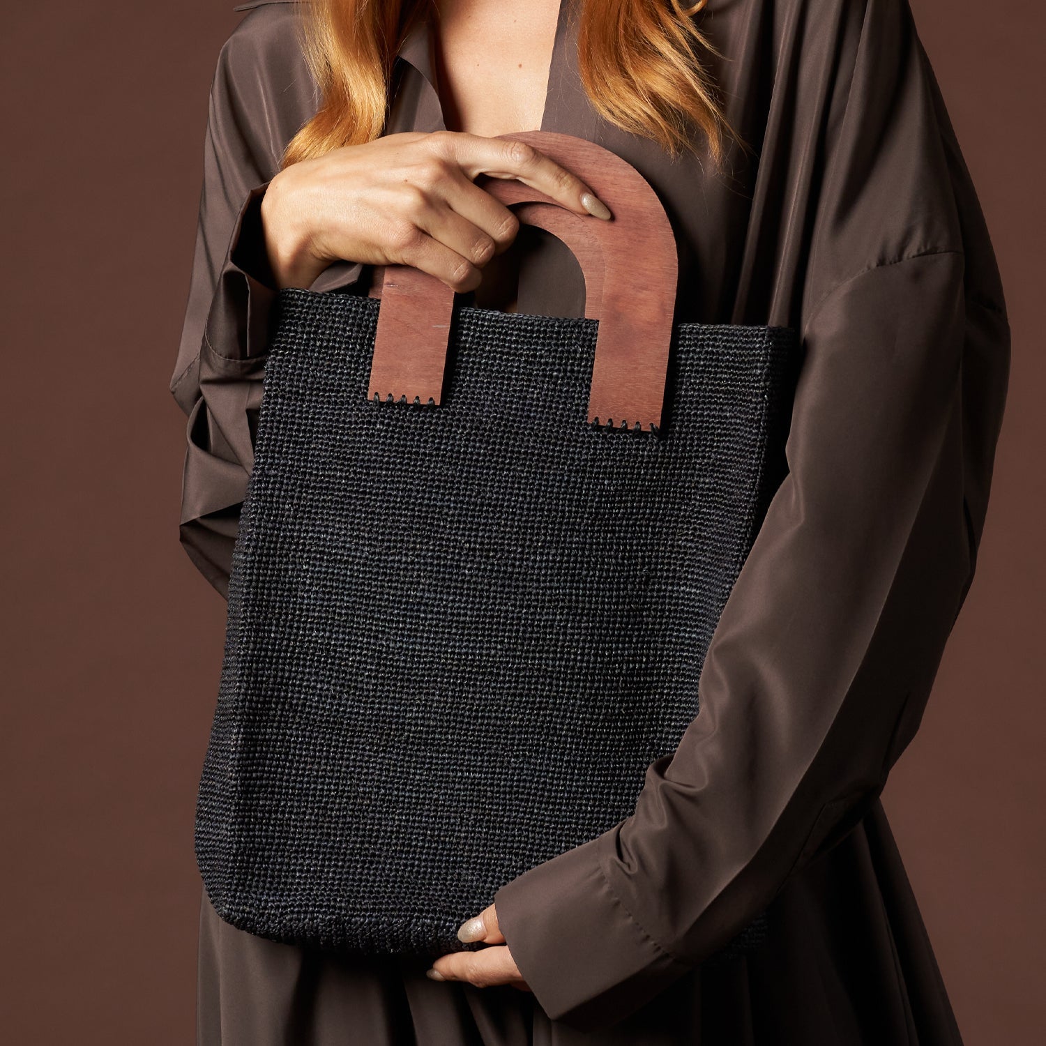 Black woven tote with wooden handles from Milano, ethically handcrafted with toquilla straw