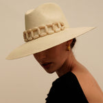 Wide-brimmed straw hat with beaded band, made from sustainable Toquilla straw