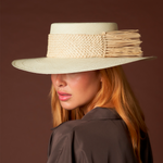 Wide-brimmed straw hat with woven band, a Genuine Panama Hat ethically handcrafted from Toquilla straw