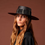 Black Toledo straw hat featuring light-colored accents made from natural toquilla straw