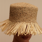 Handwoven Isola Packable genuine Panama hat with frayed edges and toquilla straw