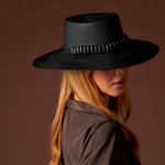Black straw hat with beaded band featuring tagua nut beads in the Raku - Wide Brim