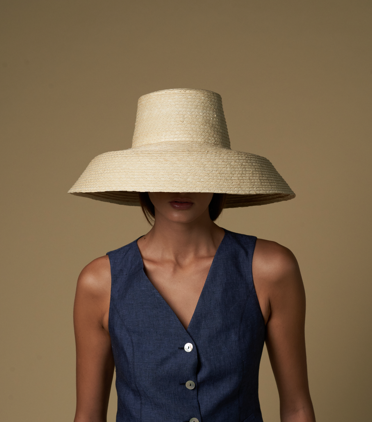Wide-brimmed straw hat made of natural mocora straw, perfect for sunny days in Bali