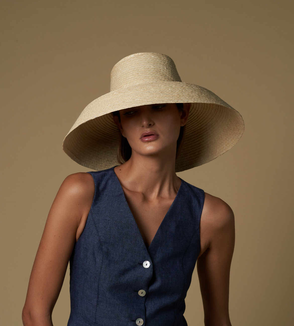 Wide-brimmed straw hat made from natural mocora straw for stylish sun protection in Bali