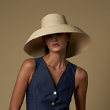 Wide-brimmed straw hat made from natural mocora straw for stylish sun protection in Bali