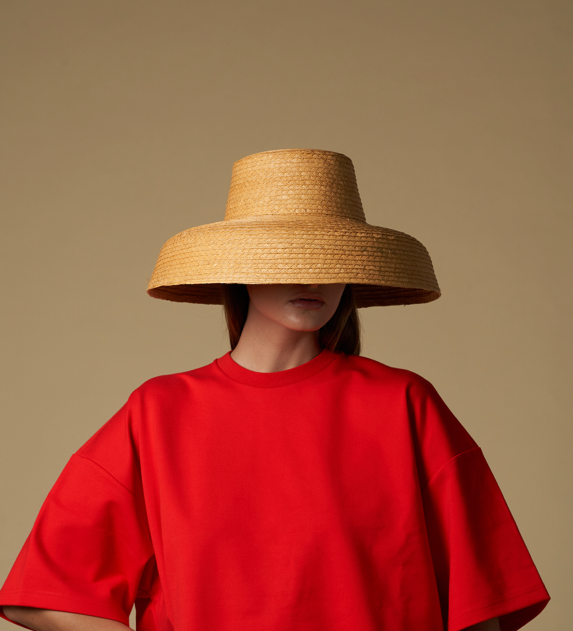 Wide-brimmed straw hat made of natural mocora straw, perfect for Bali vacations