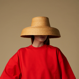Wide-brimmed straw hat made of natural mocora straw, perfect for Bali vacations
