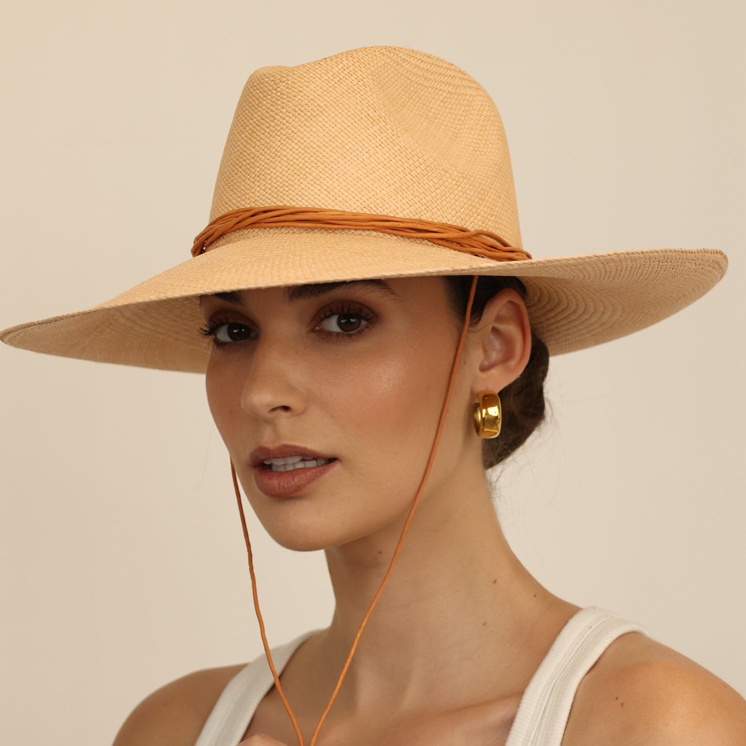 Wide-brimmed straw hat with chin strap made from natural Toquilla straw, perfect Panama hat