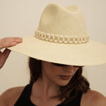 Wide-brimmed straw hat with beaded band made of natural toquilla straw